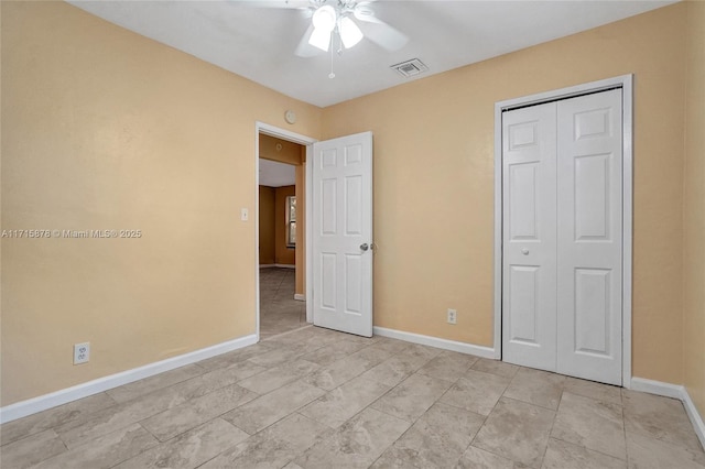 unfurnished bedroom with a closet and ceiling fan