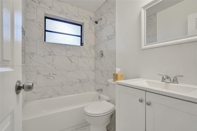 full bathroom with vanity, tiled shower / bath combo, and toilet