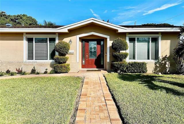 entrance to property with a yard