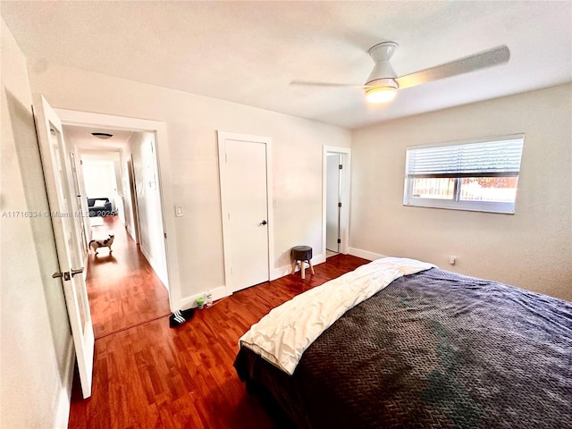 bedroom with hardwood / wood-style floors and ceiling fan