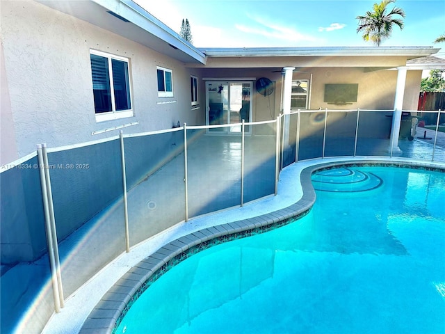 view of pool featuring ceiling fan