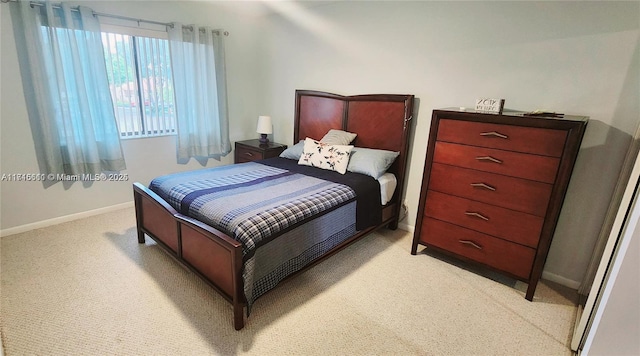 bedroom with light colored carpet