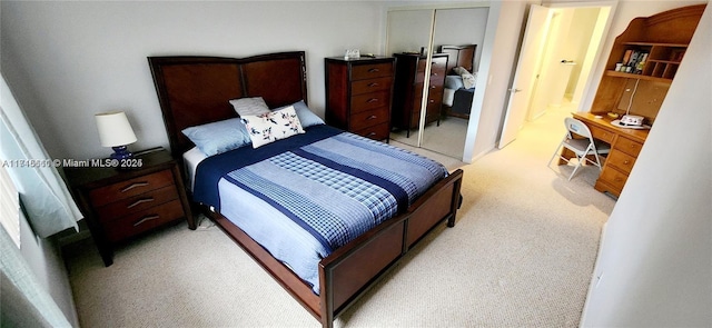 carpeted bedroom featuring a closet