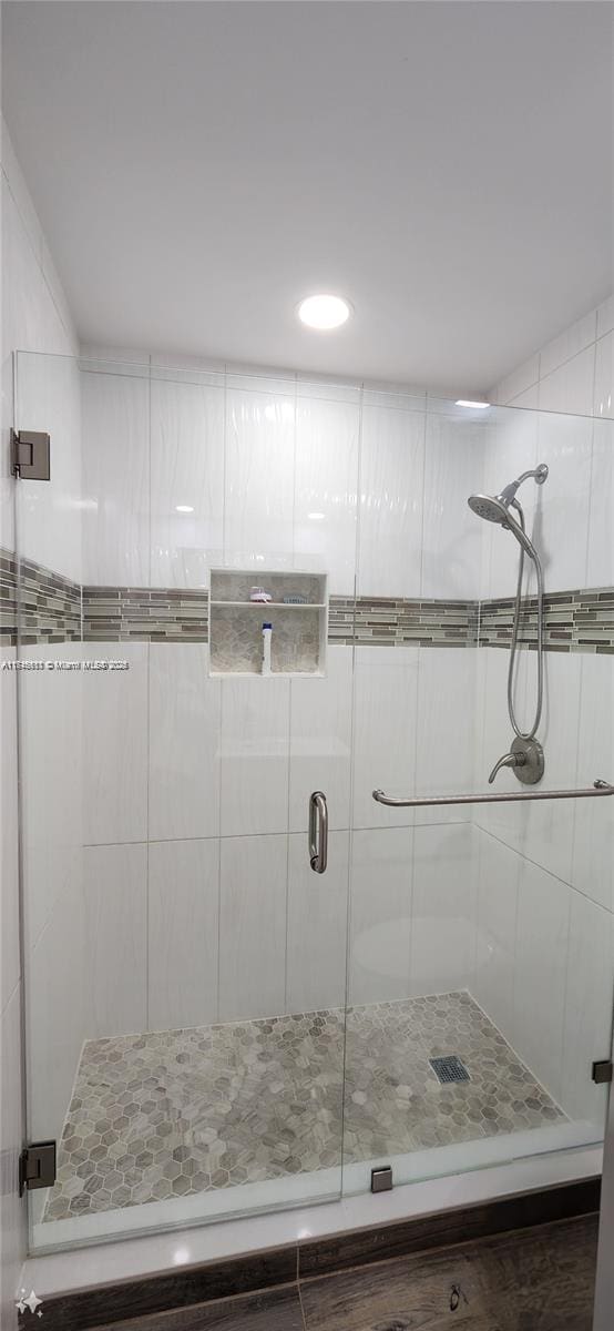 bathroom featuring an enclosed shower