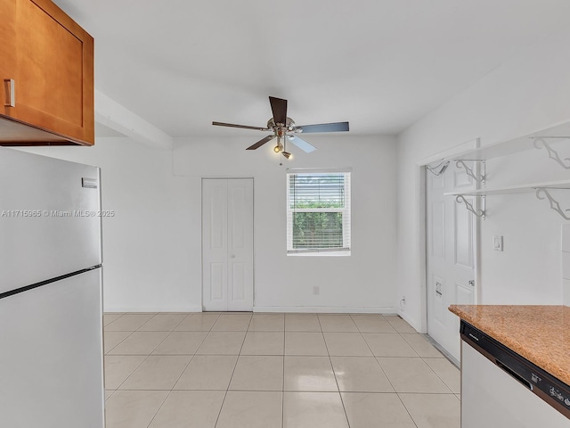 kitchen featuring dishwasher, light tile patterned floors, fridge, and ceiling fan