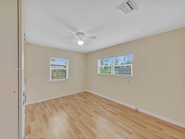 empty room with light hardwood / wood-style flooring and ceiling fan