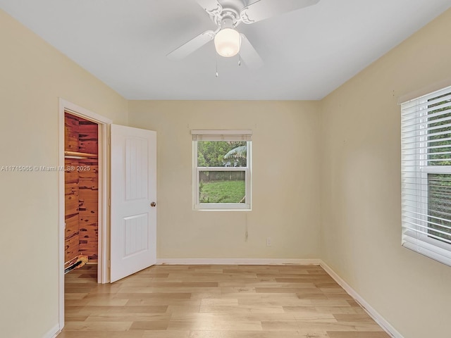 empty room featuring light hardwood / wood-style flooring and ceiling fan