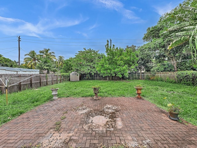 view of patio with a storage unit