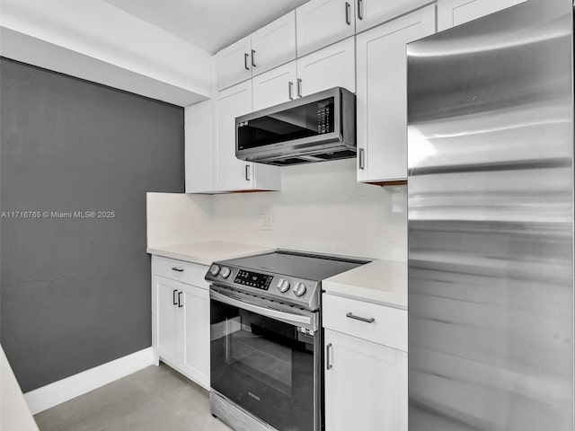 kitchen featuring white cabinets and stainless steel appliances