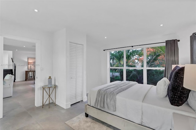 bedroom featuring a closet and expansive windows