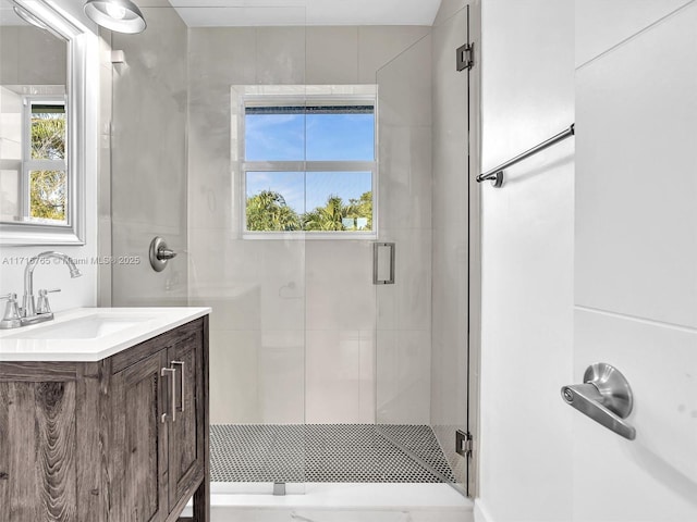 bathroom with vanity and an enclosed shower