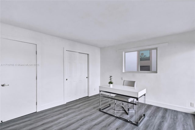 office area featuring dark wood-type flooring