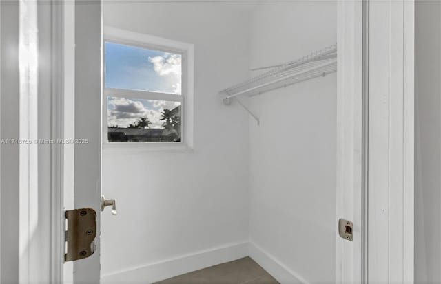 washroom featuring tile patterned flooring