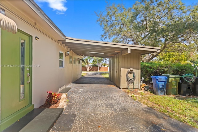 exterior space with a carport