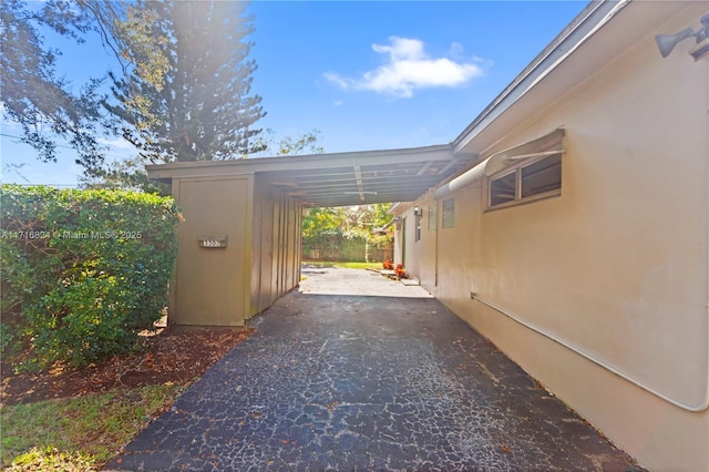 exterior space with a carport