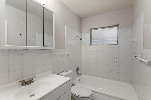 full bathroom with toilet, vanity, tile walls, tiled shower / bath combo, and decorative backsplash