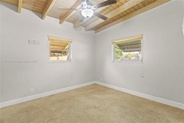 empty room with ceiling fan, carpet floors, wood ceiling, and vaulted ceiling with beams