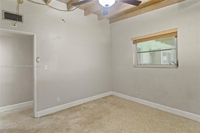 empty room featuring ceiling fan, wood ceiling, and beamed ceiling