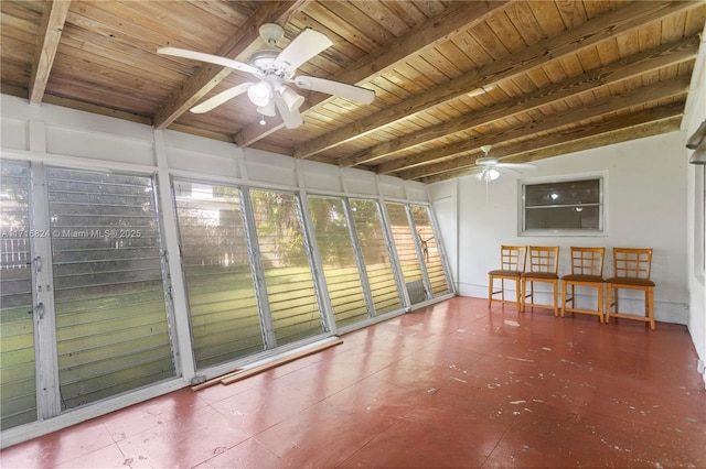 unfurnished sunroom featuring wooden ceiling, ceiling fan, and beamed ceiling