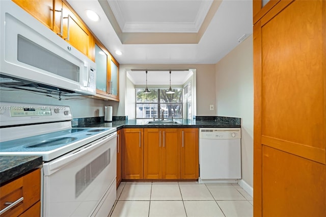 kitchen with white appliances, crown molding, sink, dark stone countertops, and light tile patterned floors