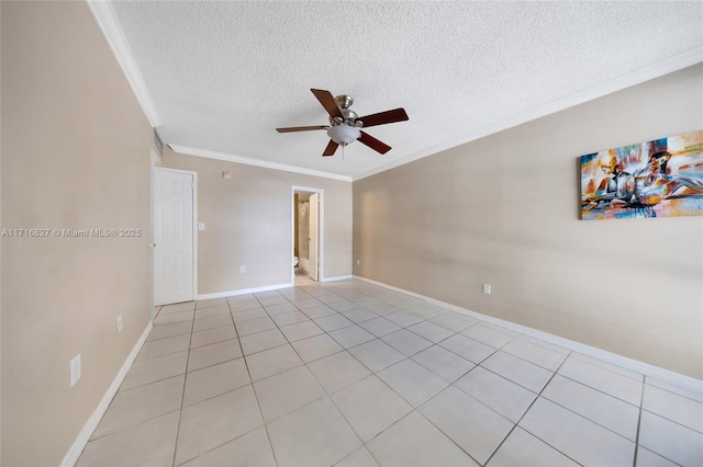 unfurnished room with ceiling fan, light tile patterned flooring, ornamental molding, and a textured ceiling