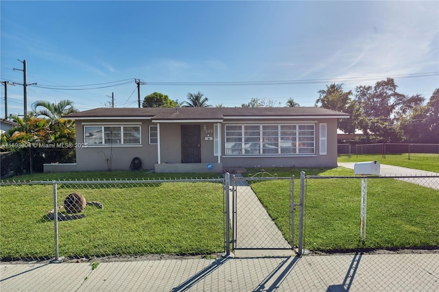 ranch-style home with a front yard