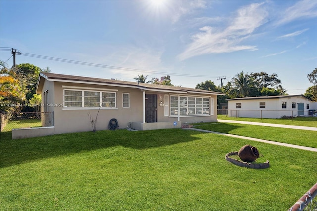 ranch-style house with a front yard