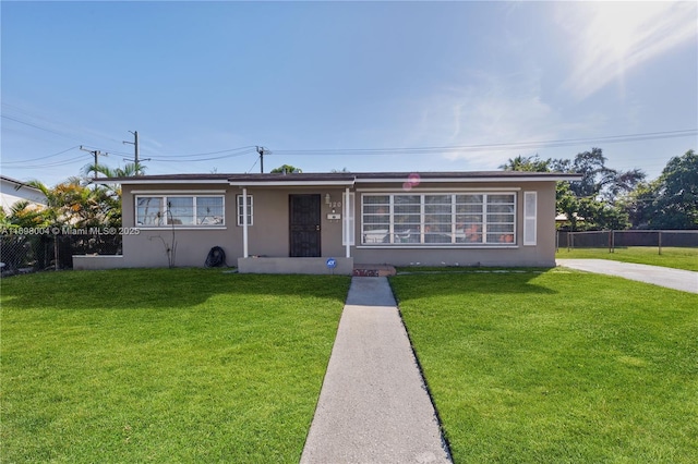 view of front of home with a front lawn