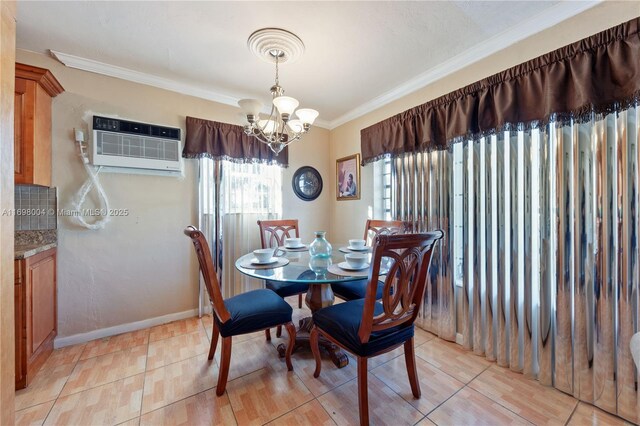 dining room featuring ornamental molding, light tile patterned floors, a wall unit AC, and a notable chandelier