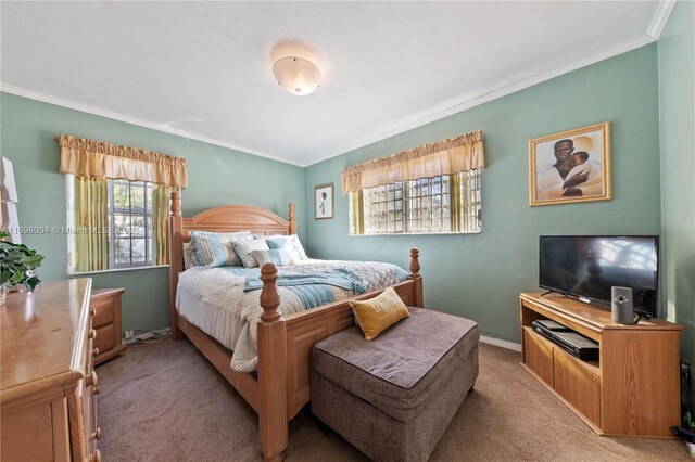 carpeted bedroom featuring ornamental molding