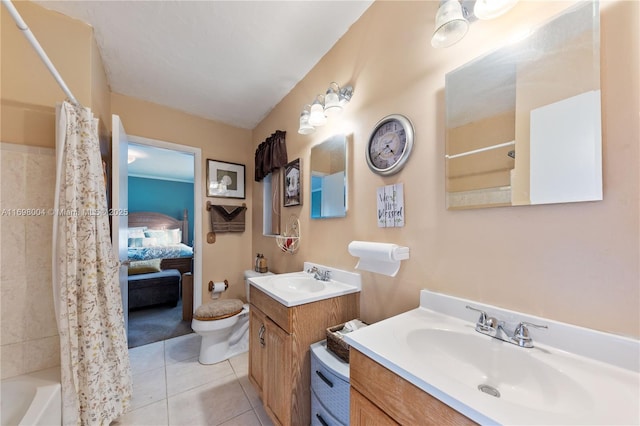 full bathroom with tile patterned flooring, shower / tub combo, vanity, and toilet