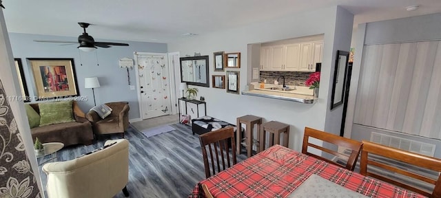 dining room with dark hardwood / wood-style floors and ceiling fan