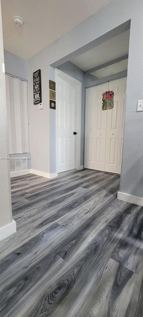 interior space featuring dark wood-type flooring