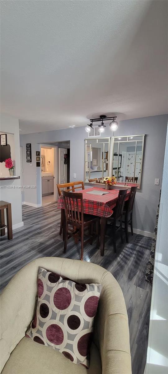 dining area with wood-type flooring