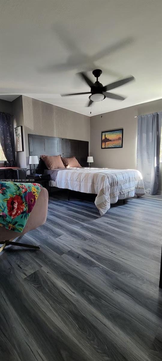 bedroom featuring ceiling fan and hardwood / wood-style flooring