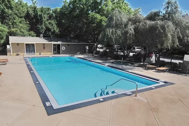 view of swimming pool featuring a patio area