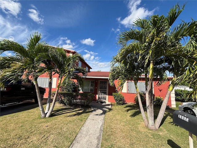 view of front of property with a front lawn