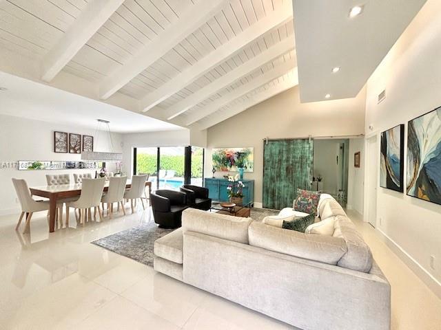 living area featuring baseboards, wood ceiling, high vaulted ceiling, beam ceiling, and recessed lighting