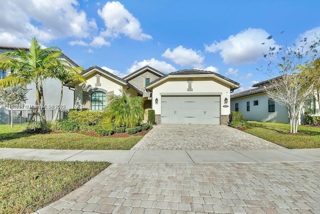 view of front of home featuring a garage