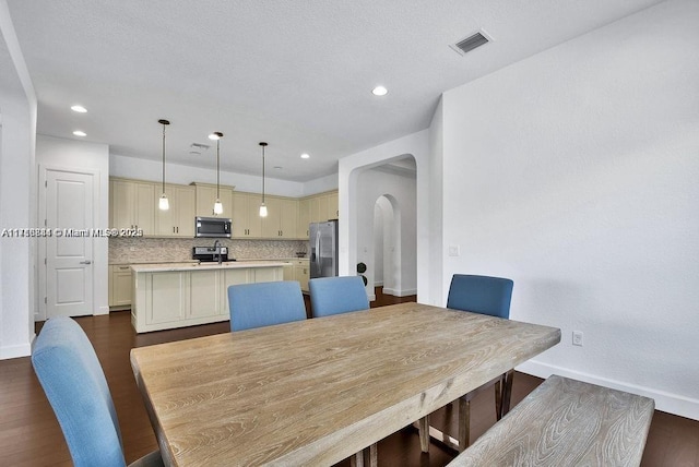 dining area with dark hardwood / wood-style floors