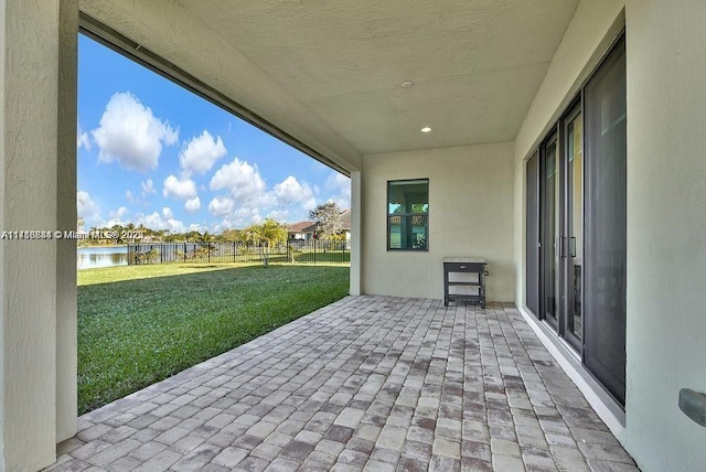 view of patio / terrace with a water view