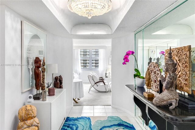 bathroom featuring tile patterned flooring and a notable chandelier