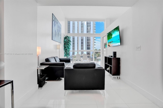 living room featuring plenty of natural light and light tile patterned flooring