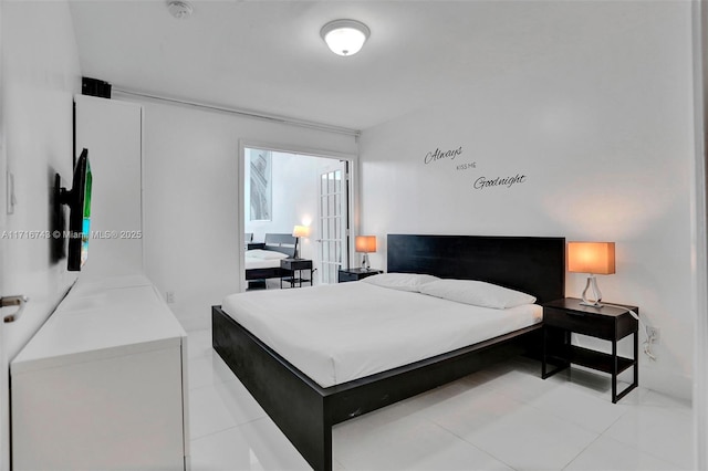 bedroom featuring light tile patterned floors