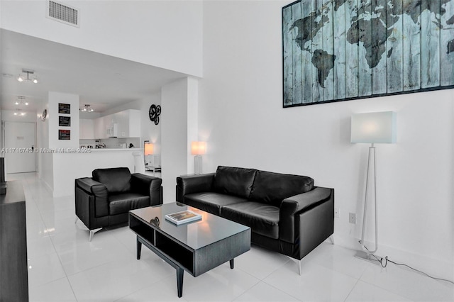 living room with light tile patterned floors