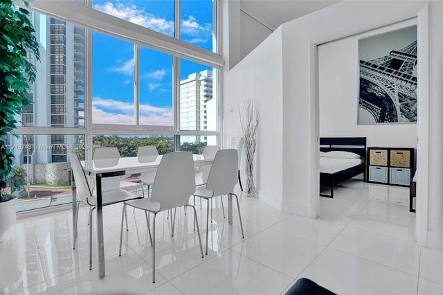 tiled dining area with expansive windows