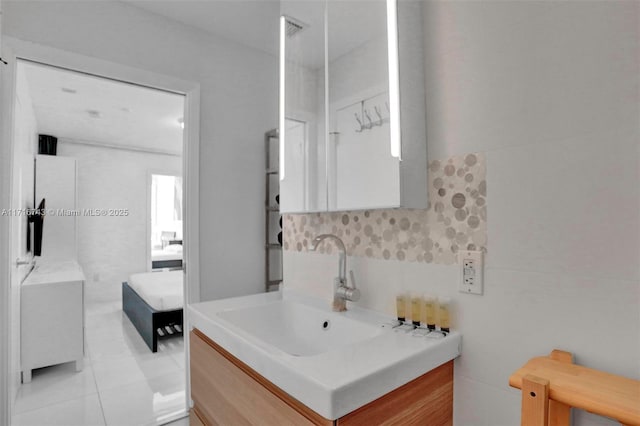 bathroom featuring tile patterned flooring and vanity