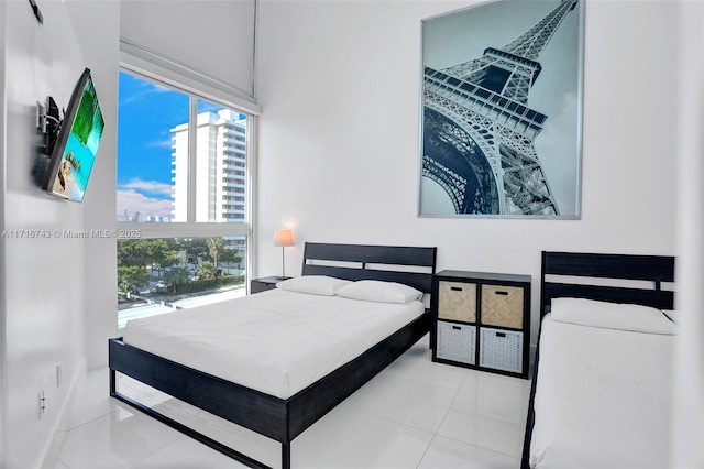 bedroom with light tile patterned floors