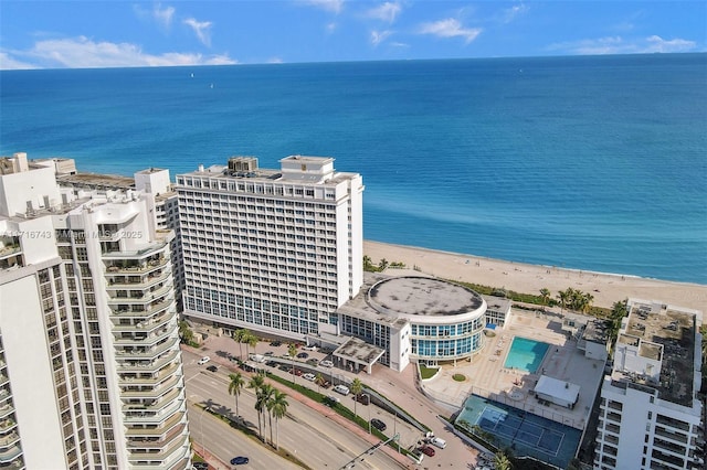 aerial view with a water view and a view of the beach