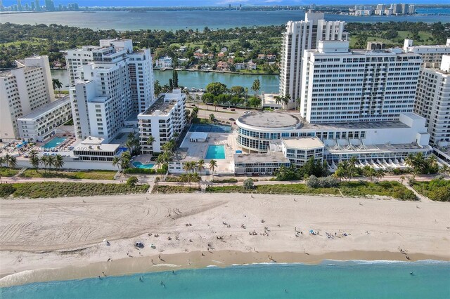 bird's eye view with a beach view and a water view